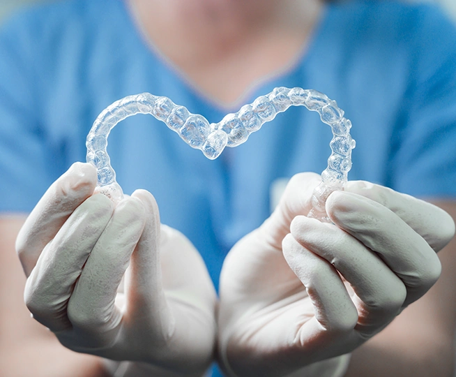 How do Invisalign and clear braces work?